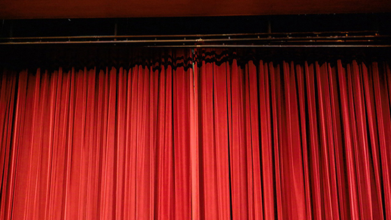 Closed red stage curtains